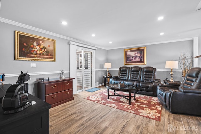 59 Mckinley Ave, Colonia, NJ 07067 - living room featuring wood finished floors, ornamental molding, and recessed lighting