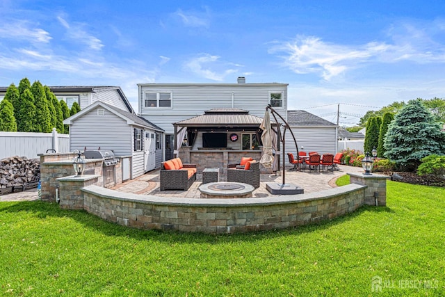 59 Mckinley Ave, Colonia, NJ 07067 - back of property with a gazebo, a fire pit, exterior kitchen, and a patio area
