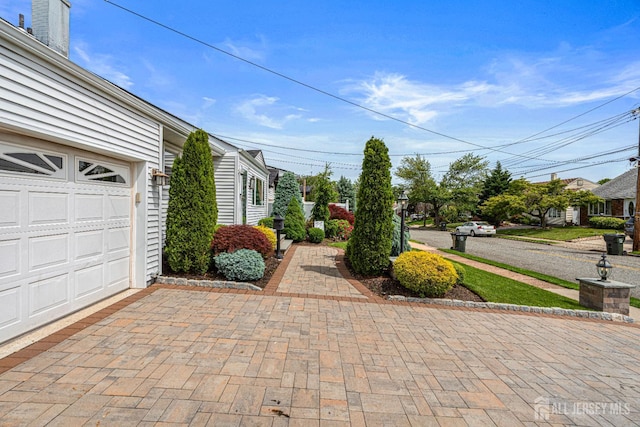 59 Mckinley Ave, Colonia, NJ 07067 - exterior space with an attached garage and driveway