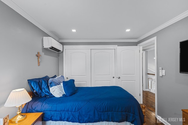59 Mckinley Ave, Colonia, NJ 07067 - bedroom featuring an AC wall unit, wood finished floors, a closet, ornamental molding, and recessed lighting
