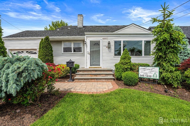 59 Mckinley Ave, Colonia, NJ 07067 - view of front of property with an attached garage, a chimney, a shingled roof, and a front lawn