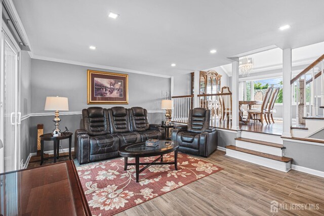 59 Mckinley Ave, Colonia, NJ 07067 - living room with baseboards, wood finished floors, ornamental molding, recessed lighting, and a chandelier