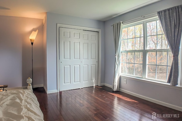 47 Bay Hill Blvd, Monroe, NJ 08831 - unfurnished bedroom featuring dark wood-style flooring and a closet