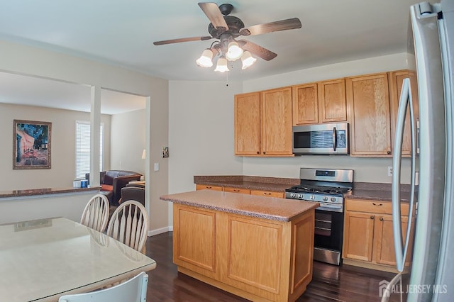 47 Bay Hill Blvd, Monroe, NJ 08831 - kitchen featuring stainless steel appliances, dark wood-style floors, a kitchen island, and a ceiling fan
