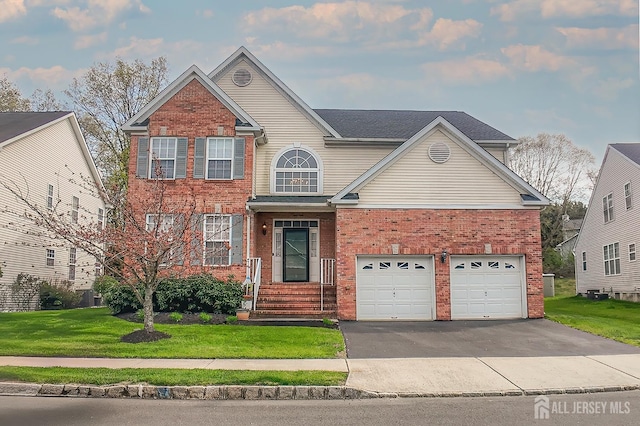 47 Bay Hill Blvd, Monroe, NJ 08831 - traditional home with brick siding, driveway, a front yard, and a garage