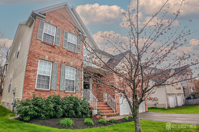 47 Bay Hill Blvd, Monroe, NJ 08831 - view of front of property with brick siding, a front yard, and a garage