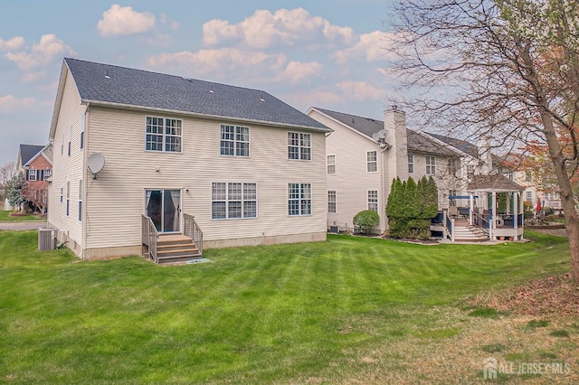 47 Bay Hill Blvd, Monroe, NJ 08831 - back of property with a gazebo, a lawn, and entry steps