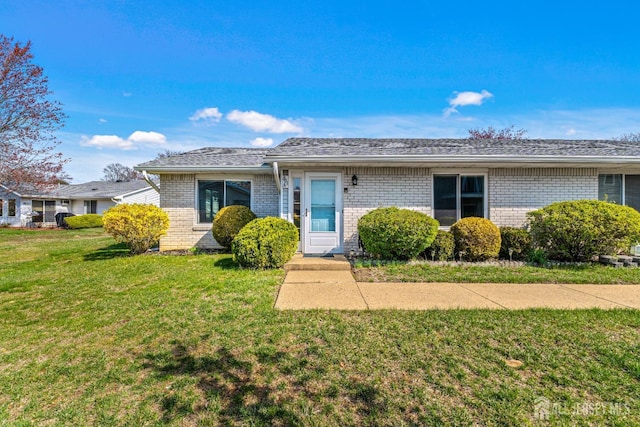 803 Pompton Rd Unit A, Monroe, NJ 08831 - view of front facade with brick siding and a front yard