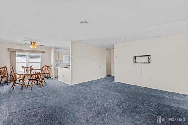 803 Pompton Rd Unit A, Monroe, NJ 08831 - living room featuring dark colored carpet, ceiling fan, and baseboards