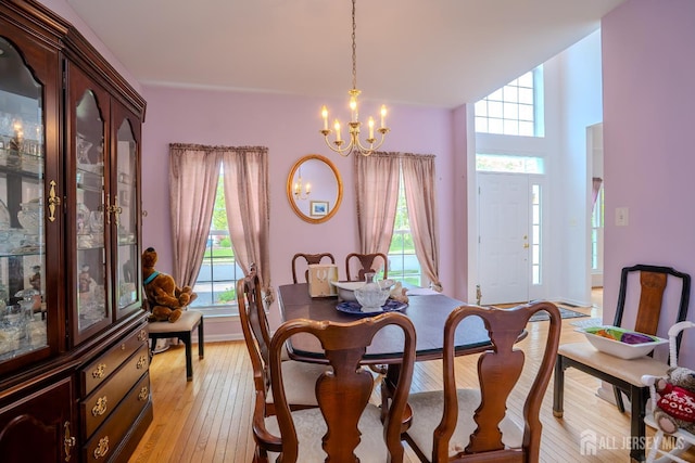 7 Sequoia Dr, South Brunswick, NJ 08810 - dining room featuring a chandelier, plenty of natural light, and light wood-type flooring