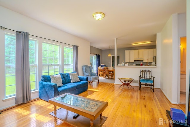 7 Sequoia Dr, South Brunswick, NJ 08810 - living room featuring light wood-style flooring and baseboards