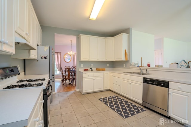 7 Sequoia Dr, South Brunswick, NJ 08810 - kitchen with dishwasher, range with gas cooktop, a sink, a chandelier, and under cabinet range hood