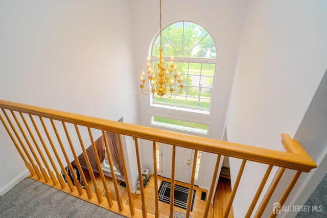 7 Sequoia Dr, South Brunswick, NJ 08810 - staircase with a chandelier and carpet floors