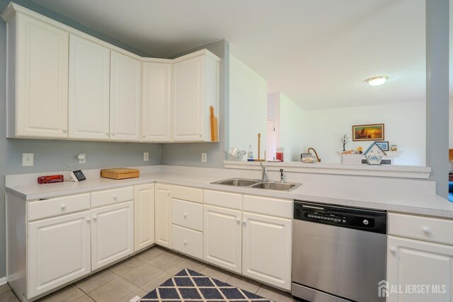 7 Sequoia Dr, South Brunswick, NJ 08810 - kitchen with dishwasher, a sink, light tile patterned floors, light countertops, and white cabinets