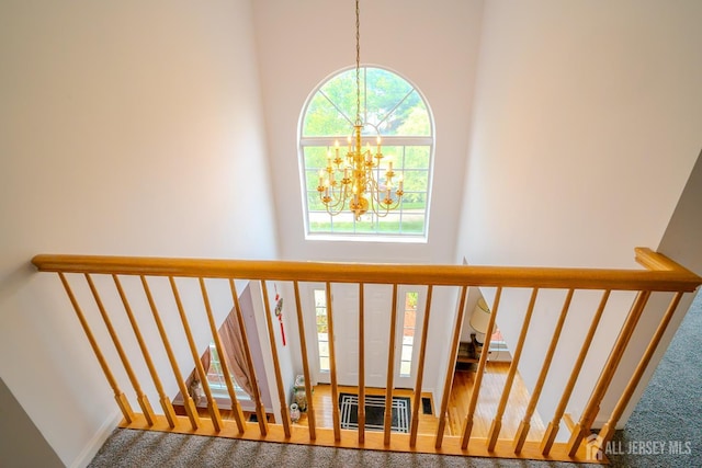 7 Sequoia Dr, South Brunswick, NJ 08810 - stairs with a chandelier, a high ceiling, and carpet