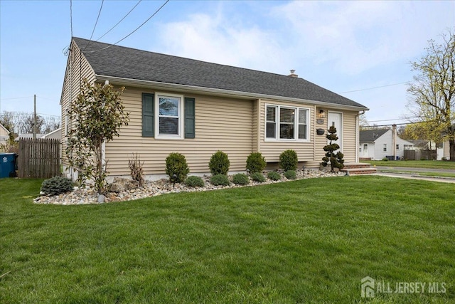 view of front of home featuring roof with shingles