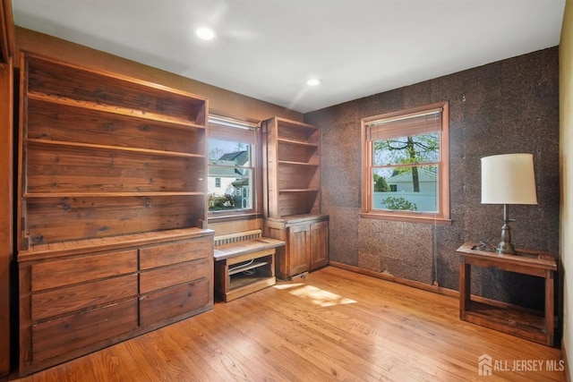 unfurnished office with light wood-type flooring, healthy amount of natural light, baseboards, and recessed lighting