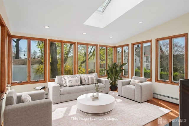 sunroom / solarium with baseboard heating, recessed lighting, a skylight, wood finished floors, and lofted ceiling