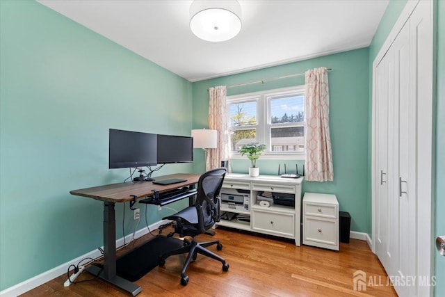office featuring wood finished floors and baseboards