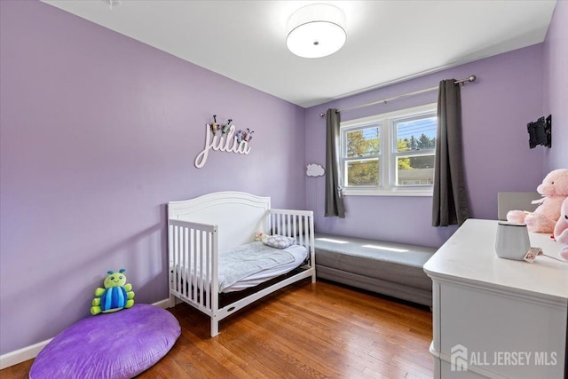 bedroom with wood finished floors