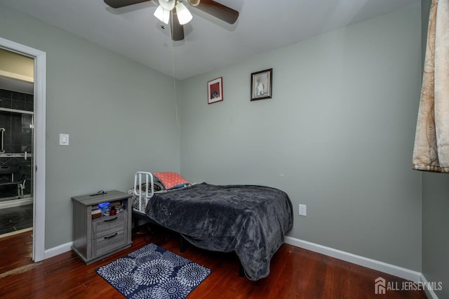 bedroom with a ceiling fan, baseboards, and wood finished floors