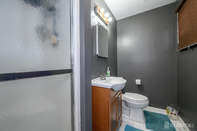 full bath featuring baseboards, toilet, tile patterned floors, vanity, and a shower stall