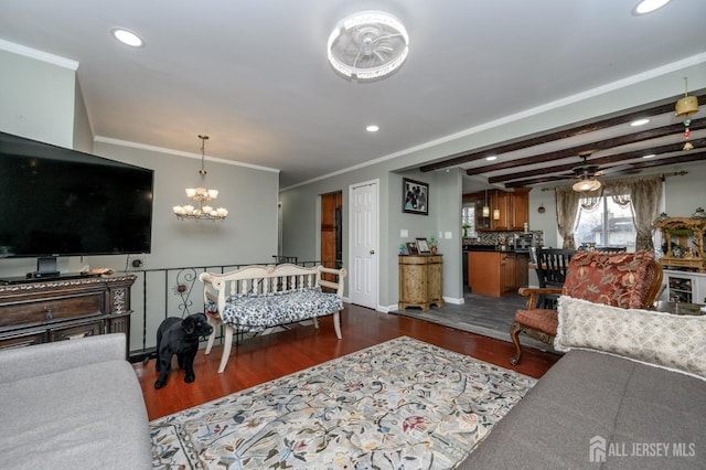 living area featuring ornamental molding, wood finished floors, and recessed lighting