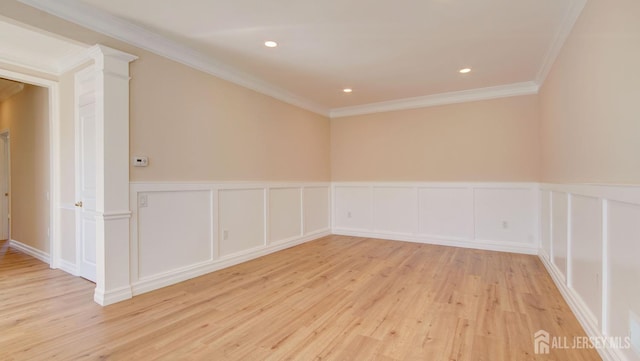 unfurnished room with light hardwood / wood-style floors and crown molding