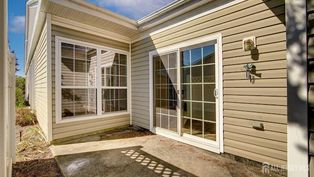 property entrance featuring a patio