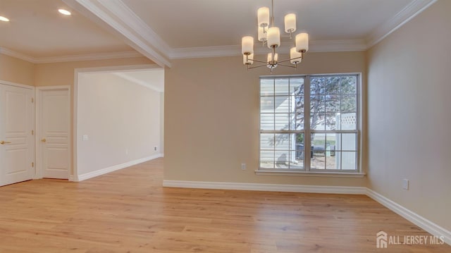 spare room featuring light hardwood / wood-style floors, crown molding, and a notable chandelier