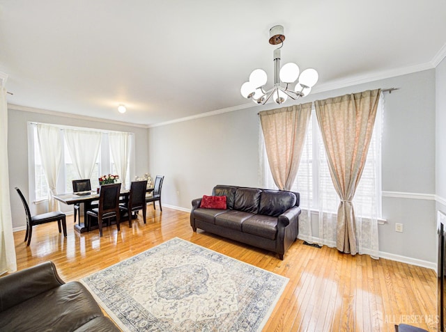 221 Morning Glory Dr, Monroe, NJ 08831 - living area with a chandelier, baseboards, hardwood / wood-style floors, and ornamental molding