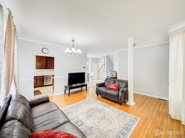 221 Morning Glory Dr, Monroe, NJ 08831 - living room featuring ornamental molding, stairway, light wood-style flooring, baseboards, and a chandelier