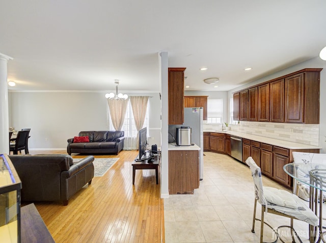 221 Morning Glory Dr, Monroe, NJ 08831 - kitchen featuring dishwasher, a chandelier, light countertops, plenty of natural light, and ornamental molding