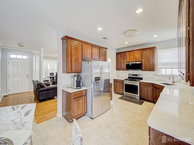 221 Morning Glory Dr, Monroe, NJ 08831 - kitchen featuring stainless steel appliances, a sink, healthy amount of natural light, tasteful backsplash, and recessed lighting