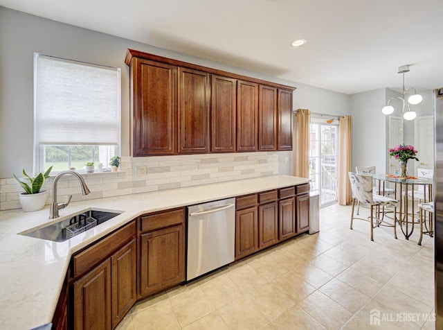 221 Morning Glory Dr, Monroe, NJ 08831 - kitchen featuring dishwasher, a sink, decorative backsplash, light countertops, and pendant lighting