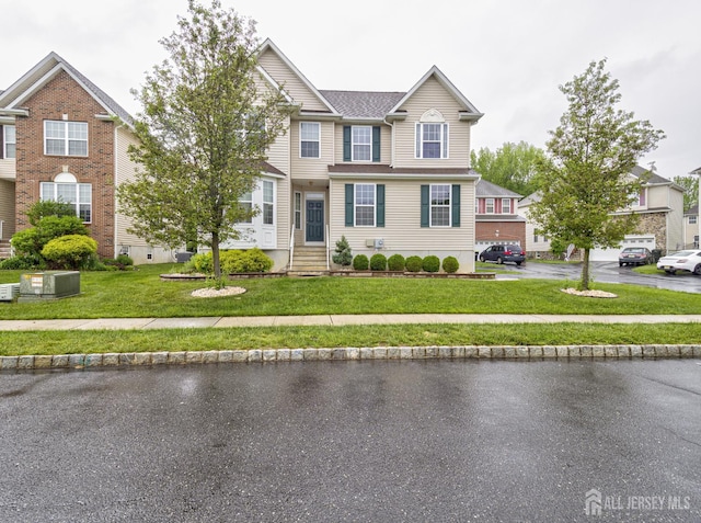 221 Morning Glory Dr, Monroe, NJ 08831 - view of front of house featuring a front yard and central AC