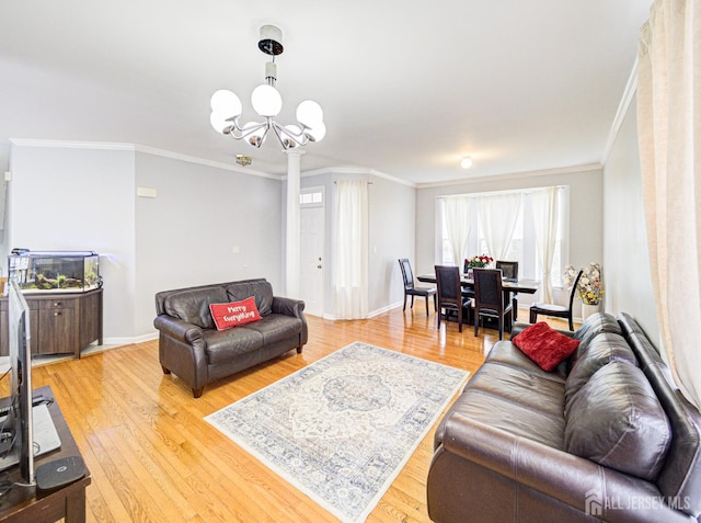 221 Morning Glory Dr, Monroe, NJ 08831 - living area featuring crown molding, light wood finished floors, a chandelier, and baseboards
