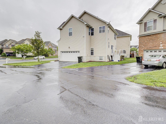 221 Morning Glory Dr, Monroe, NJ 08831 - view of home's exterior with a garage, asphalt driveway, and a residential view