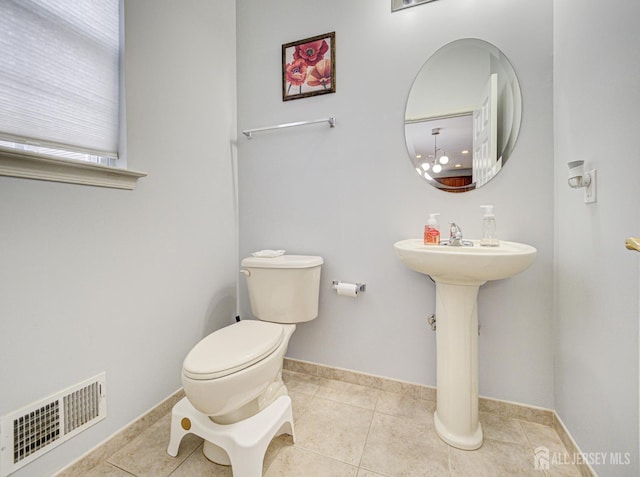 221 Morning Glory Dr, Monroe, NJ 08831 - bathroom with toilet, tile patterned floors, and baseboards
