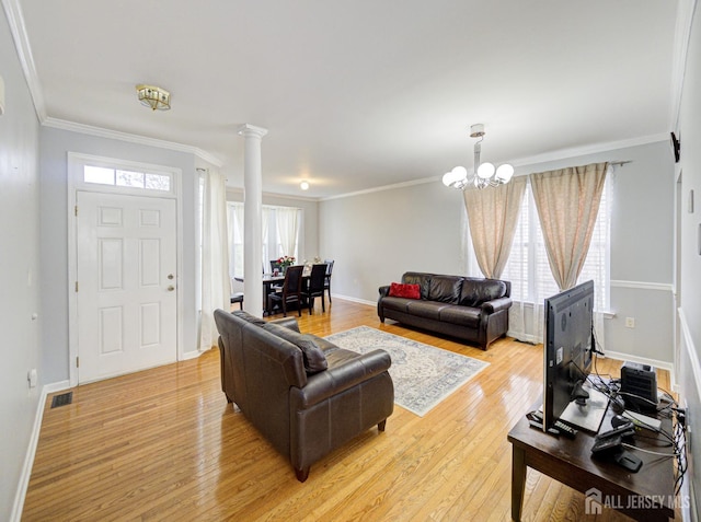 221 Morning Glory Dr, Monroe, NJ 08831 - living area featuring ornate columns, light wood-style flooring, healthy amount of natural light, baseboards, and crown molding