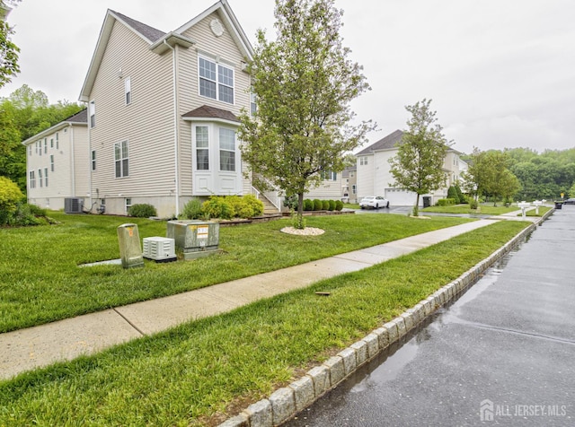 221 Morning Glory Dr, Monroe, NJ 08831 - view of side of property with a lawn and cooling unit