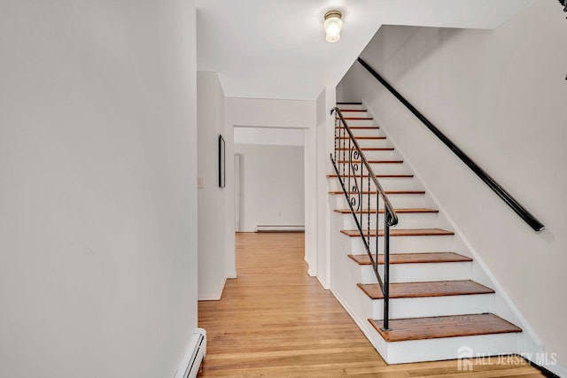 402 N Cranbury Rd Unit 8, East Brunswick, NJ 08816 - stairway with a baseboard heating unit and wood finished floors