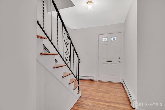 402 N Cranbury Rd Unit 8, East Brunswick, NJ 08816 - foyer featuring a baseboard radiator, light wood finished floors, and stairway