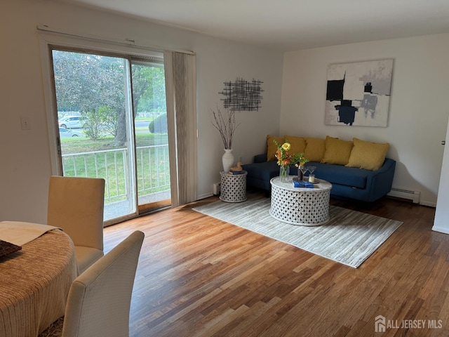 402 N Cranbury Rd Unit 8, East Brunswick, NJ 08816 - living area featuring wood finished floors and a baseboard radiator