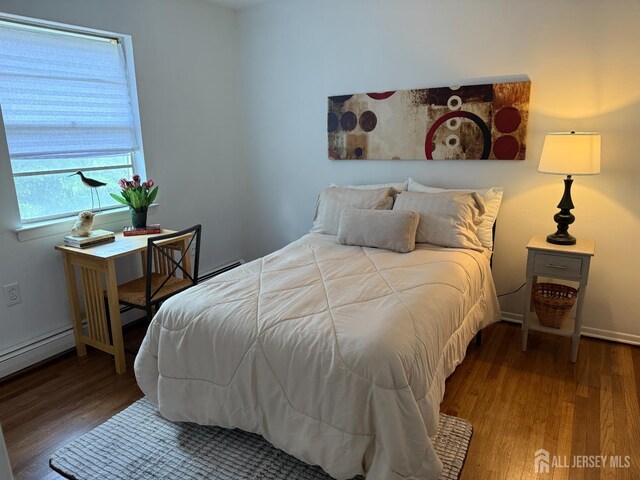 402 N Cranbury Rd Unit 8, East Brunswick, NJ 08816 - bedroom featuring wood finished floors and baseboards