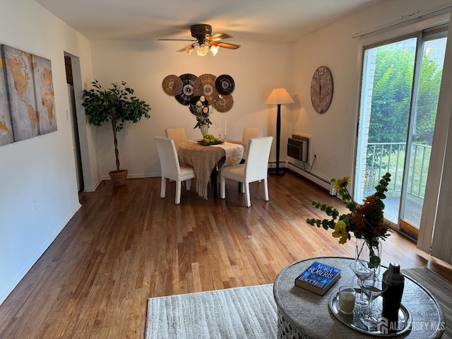 402 N Cranbury Rd Unit 8, East Brunswick, NJ 08816 - dining area featuring wood finished floors, a baseboard radiator, ceiling fan, and a wall mounted AC