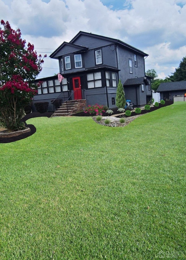 view of front of home with a front lawn