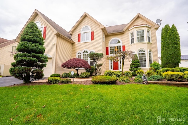 4 Bernadette Cir S, Brunswick, NJ 08852 - view of front of home featuring a front yard and a garage