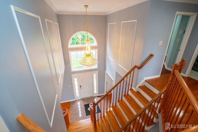 4 Bernadette Cir S, Brunswick, NJ 08852 - foyer entrance featuring a chandelier, baseboards, stairs, a towering ceiling, and granite floors
