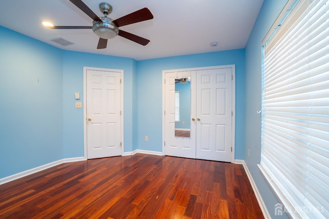4 Bernadette Cir S, Brunswick, NJ 08852 - unfurnished bedroom with dark wood-style floors, baseboards, a ceiling fan, and a closet